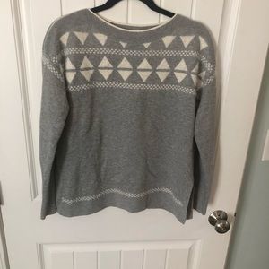 Grey sweater with white geometric detailing